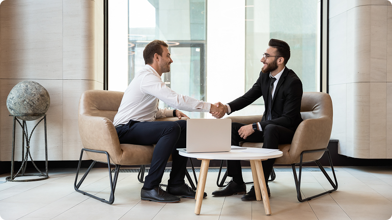 Two business professionals shaking hands during a consultation about business insurance solutions in Perth.