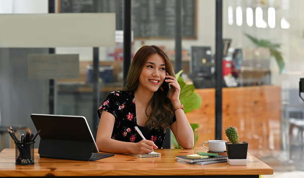 Friendly insurance broker providing personalised insurance advice and ongoing support to a business client.