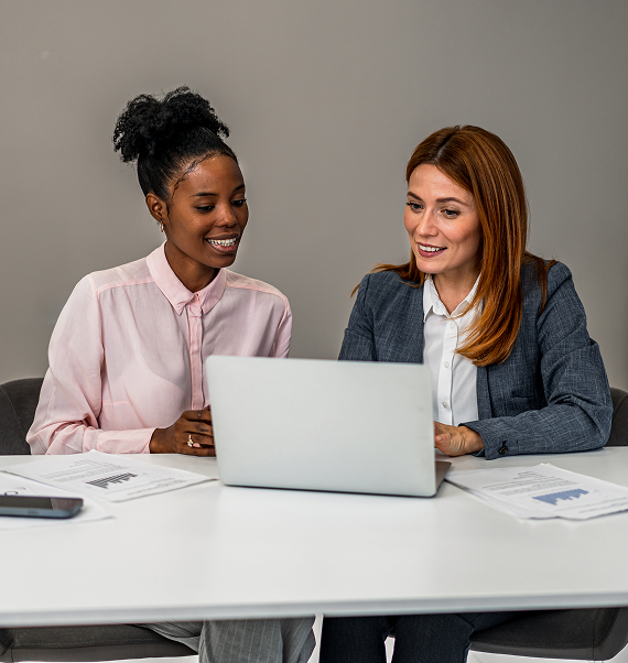 Two professionals reviewing industry-specific insurance options during a business consultation.